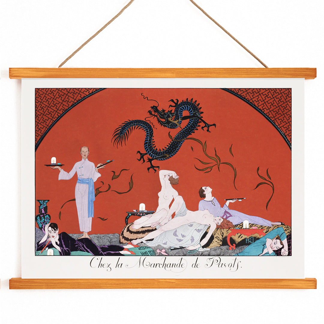 Opulent oriental scene with reclining figures and a blue dragon in Chez la Marchande de Pavots by George Barbier poster on a red background, with wooden magnetic frame on white background