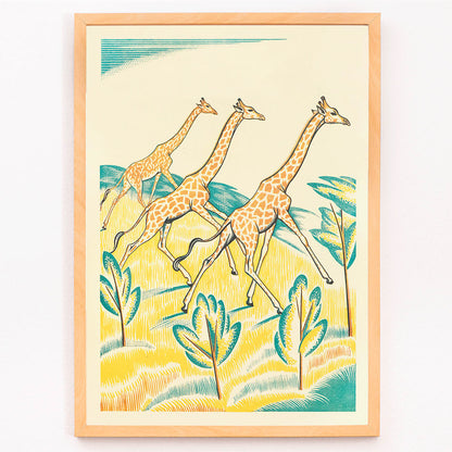 Colorful jungle artwork with three giraffes by Clifford Webb titled A Jungle Picnic Pl.04 Girafe, framed and displayed in modern living room decor