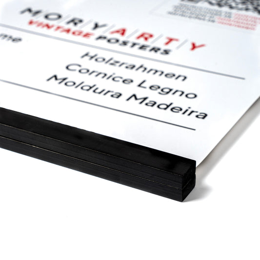 Black Pine magnetic wood frame with two sleek wooden bars and a simple rope for hanging, displaying a poster on a wall in a modern, elegant setting, front corner closeup picture