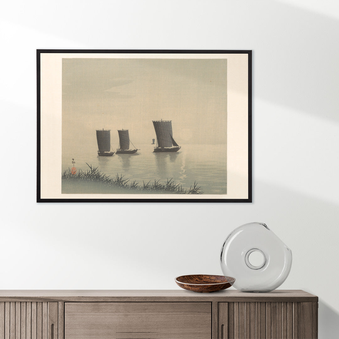 Serene Japanese art of three traditional fishing boats on calm water at sunset by Ohara Koson, framed and displayed in home decor