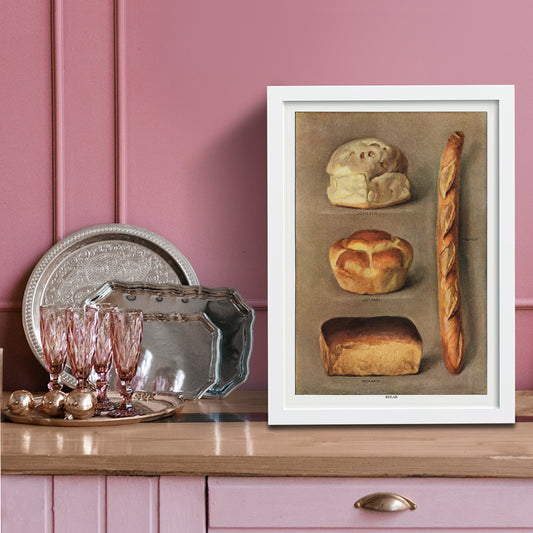 Assorted bread loaves including domestic cottage French and graham from The Grocers Encyclopedia vintage artwork collection of baked bread types poster, framed and displayed in home decor