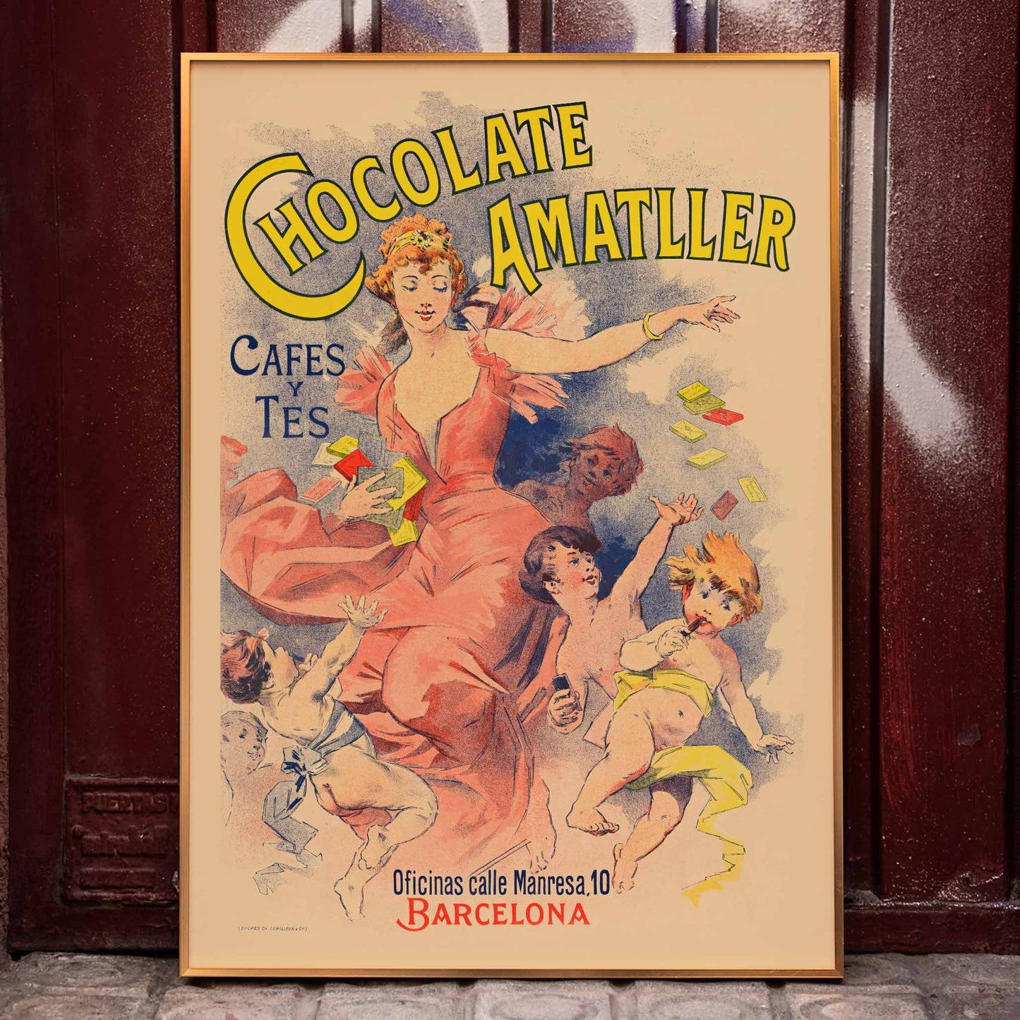 Anonymous Chocolate Amatller poster with dancing woman and children, bold yellow lettering, warm pastel tones, framed and displayed in home decor