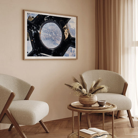 Earth view from International Space Station cupola by NASA with planet visible below poster artwork, framed and displayed in home decor
