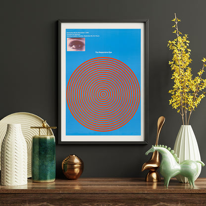 Op art poster with blue and red concentric circles and eye detail from The Responsive Eye by Patrick Blackwell, framed and displayed in home decor