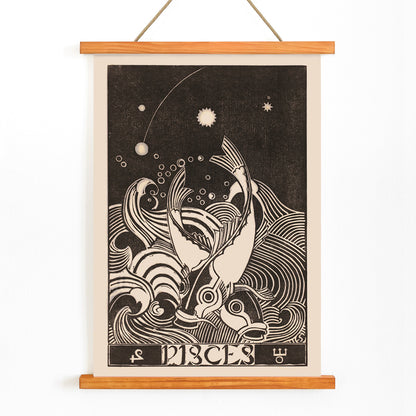 Black and white Pisces zodiac sign illustration with two stylized fish swimming among swirling waves artwork by Henri van der Stok, with wooden magnetic frame on white background