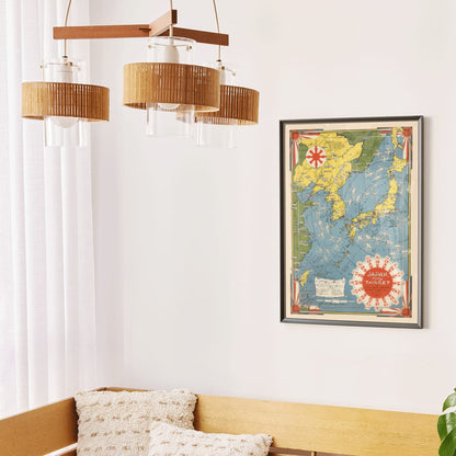 Colorful illustrated map of Japan and surrounding regions by Ernest Dudley Chase titled Japan the Target a Pictorial Jap-map poster, framed and displayed in modern living room decor