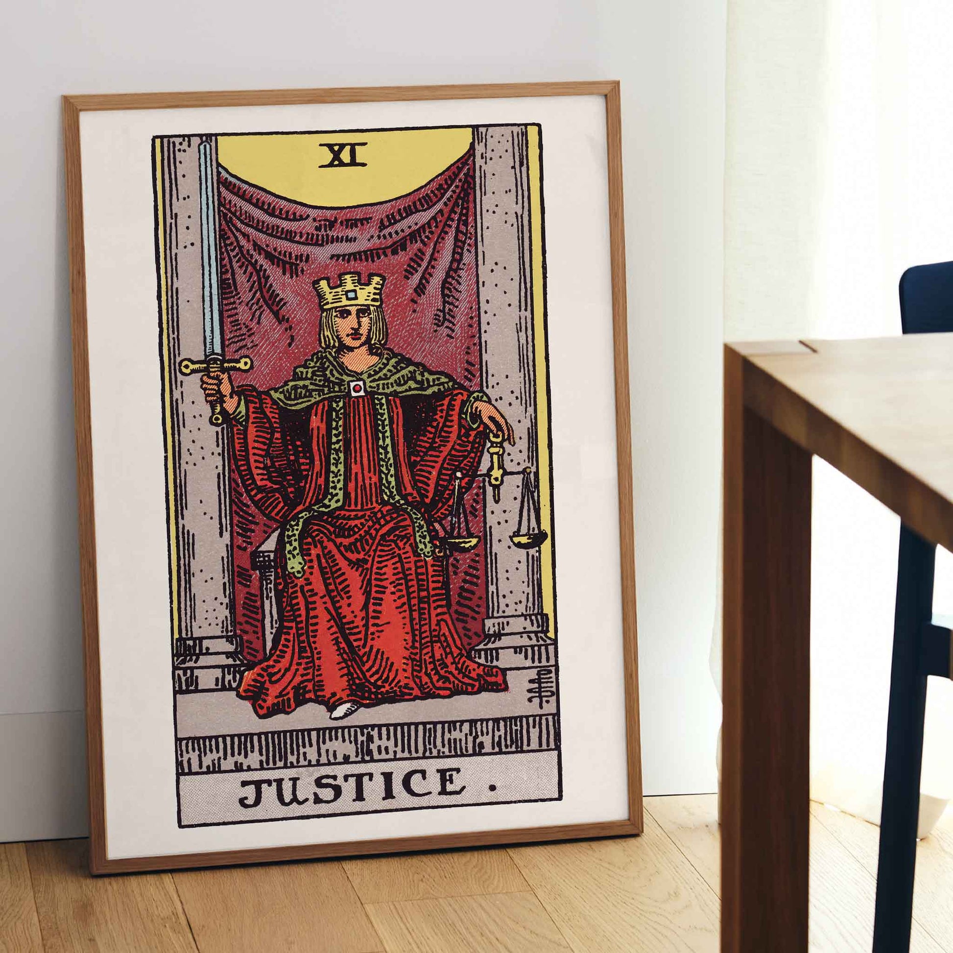 Pamela Colman Smith Justice tarot poster crowned figure in red robes with scales and sword, framed and displayed in modern living room decor