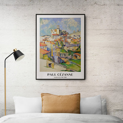 Colorful village landscape painting and poster of Gardanne by Paul Cézanne featuring red roofed houses and bright sky, framed and displayed in home decor