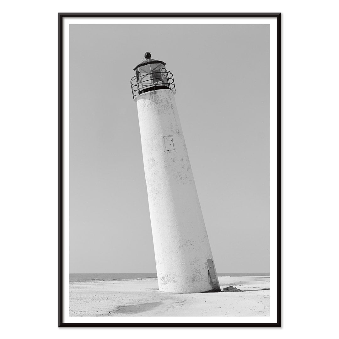 Cape Saint George Lighthouse poster featuring a tilted lighthouse on a sandy beach in Apalachicola Franklin County Florida, with black aluminium frame on white background