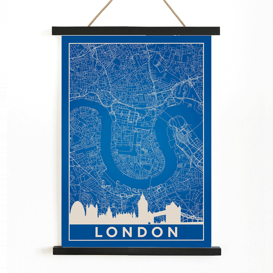 Minimalist London map artwork poster with blue background white map details by artist Anonymous featuring major landmarks, with wooden magnetic frame on white background