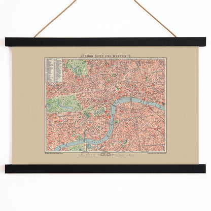 Ancient map of London by Bibliographic institute of Liepzig showing detailed vintage city streets river Thames and parks, with wooden magnetic frame on white background