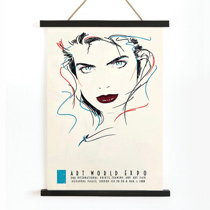 Metropolis Julie female portrait by Dennis Mukai colorful abstract lines bold lips poster at Art World Expo, with wooden magnetic frame on white background