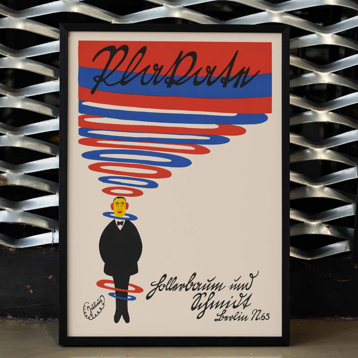 Julius Klinger Hollerbaum und Schmidt poster with red and blue spiral lettering and minimalist suited figure on beige background, framed and displayed in home decor