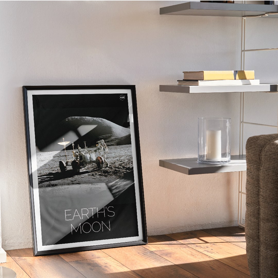 Astronaut beside lunar rover on the moon surface Man on Moon 1 by NASA poster with Earths Moon text, framed and displayed in home decor
