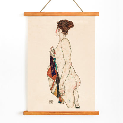 Standing nude woman with a patterned robe artwork by Egon Schiele side view and colorful robe poster, with wooden magnetic frame on white background