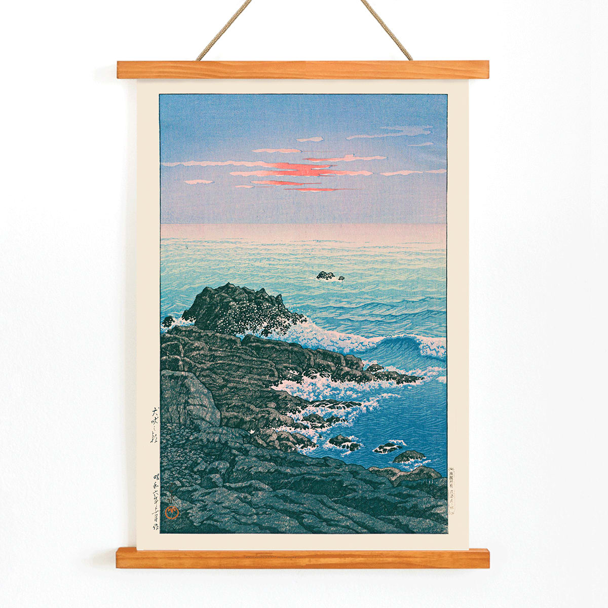 Morning at Cape Inubo by Kawase Hasui seascape with waves crashing on rocky shore at sunrise coastal scene poster, with wooden magnetic frame on white background