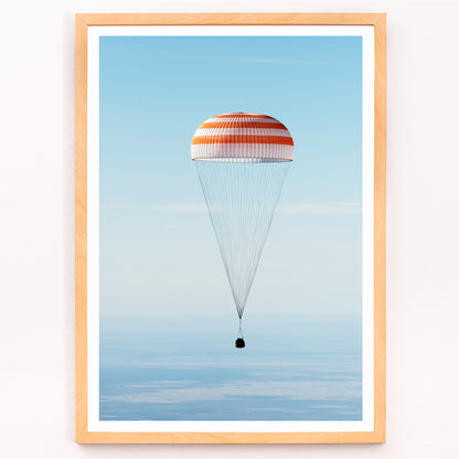 Closeup detail of Soyuz MS-02 spacecraft descending with parachute over Kazakhstan NASA poster titled The Soyuz MS-02 spacecraft lands