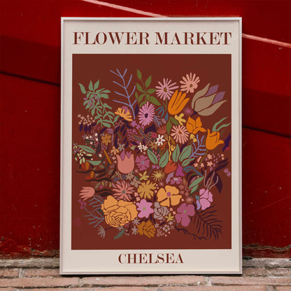 Colorful floral poster by Moryarty titled Flower Market Chelsea featuring various vibrant flowers on a brown background, framed and displayed in home decor
