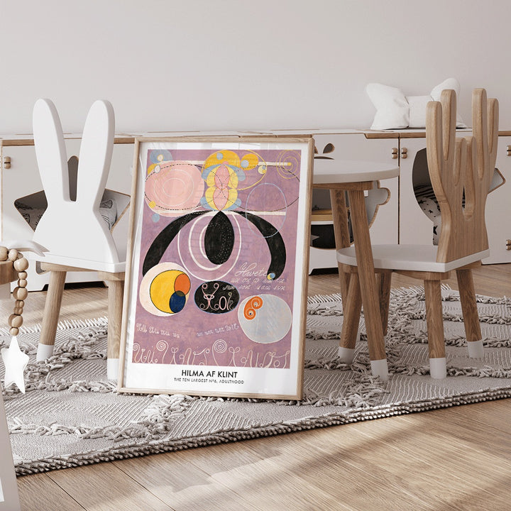 Abstract colorful pastel shapes and spirals artwork from The Ten Largest No 6 by Hilma af Klint poster, framed and displayed in modern living room decor