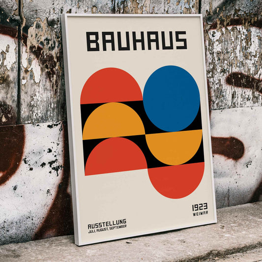 Bauhaus Poster 18 with bold geometric shapes in red blue and yellow on a white background minimalist design primary colors and Bauhaus text at the top, framed and displayed in home decor