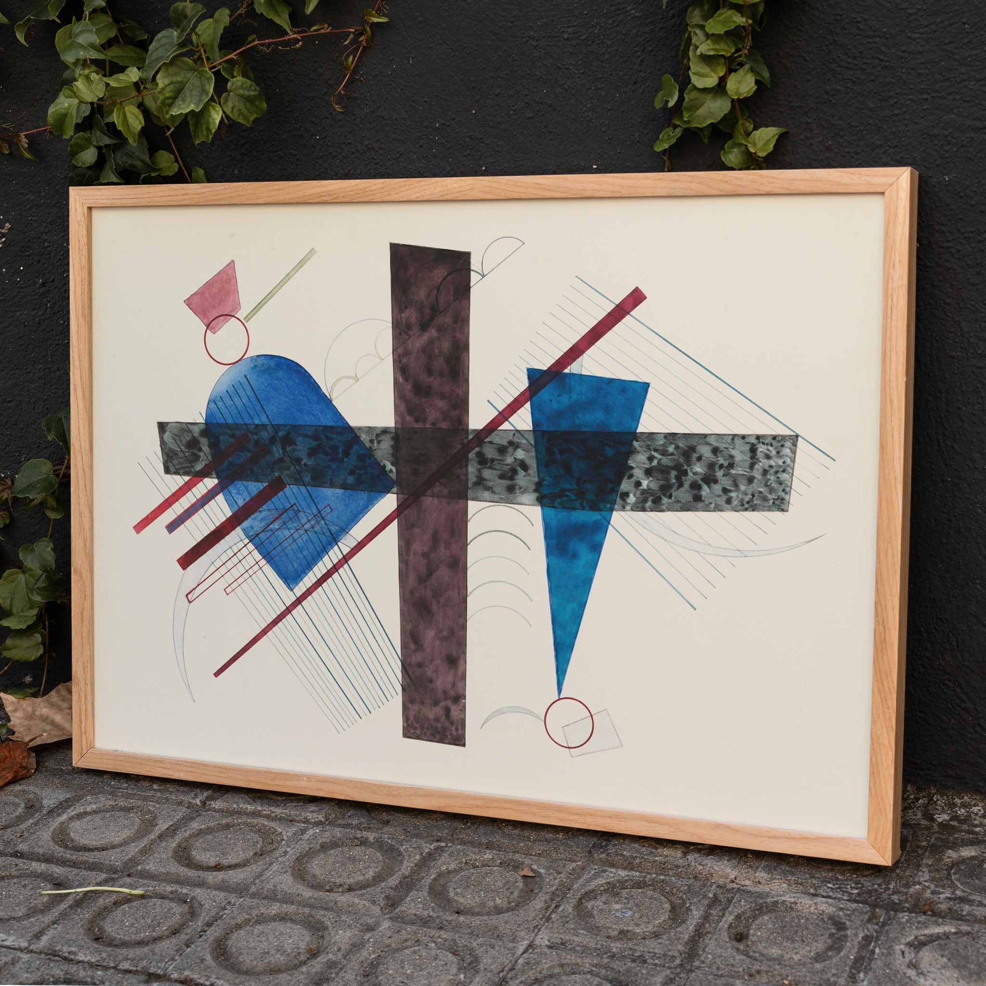 Abstract geometric poster with blue and red shapes artwork Blau in Rund und Spitz by Wassily Kandinsky, framed and displayed in home decor