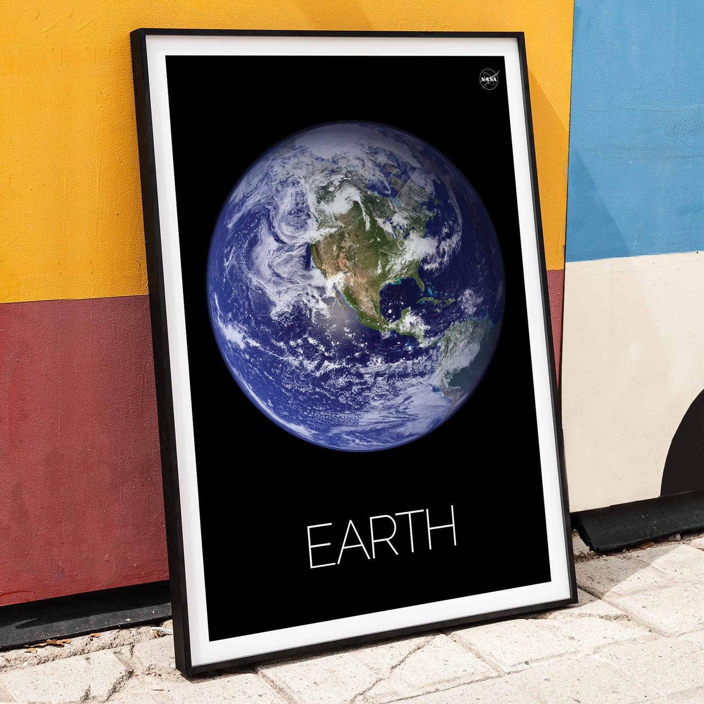 Stunning NASA image of Earth from space titled Earth from Space 1 on a black background poster, framed and displayed in home decor
