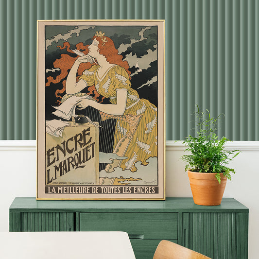 Art Nouveau poster of a woman in a yellow dress with flowing red hair writing at a desk for Encre Marquet by Eugene Grasset, framed and displayed in home decor