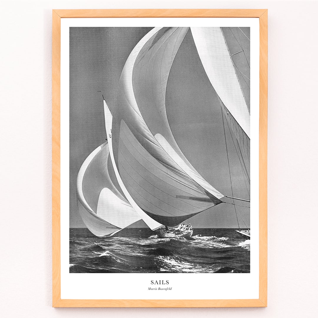 Sailing yacht with billowing sails on the open ocean by Morris Rosenfeld titled Sails poster artwork, framed and displayed in modern living room decor