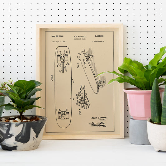 Technical illustration and poster of skateboard brake concept by artist A O Waddell titled Skate Board Brake Patent featuring labeled technical drawings for wall decor, framed and displayed in home decor