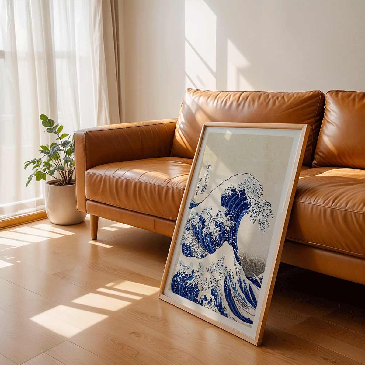 The Great Wave off Kanagawa by Katsushika Hokusai showing a dramatic large wave threatening small boats with Mount Fuji in the background, framed and displayed in modern living room decor