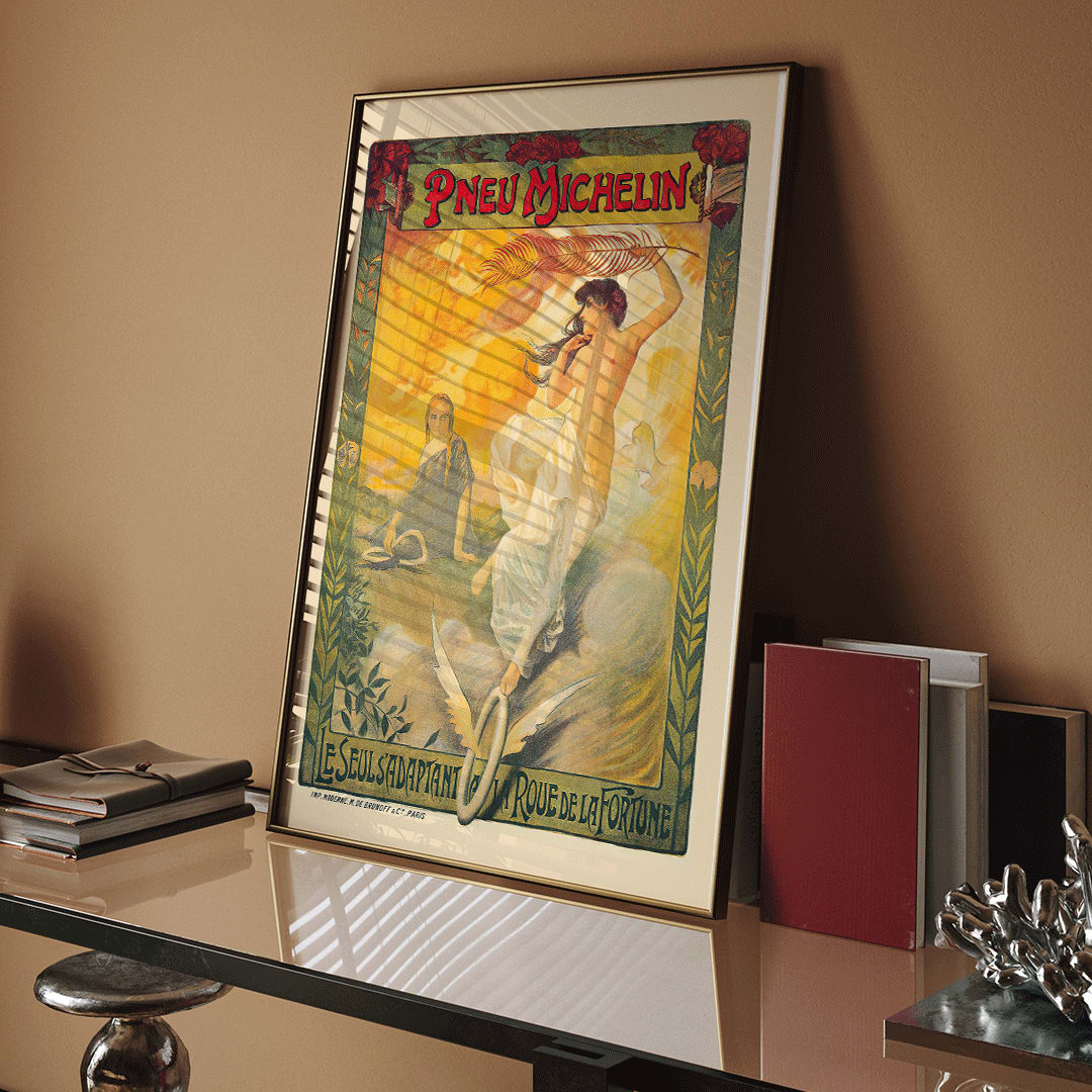 Vintage Michelin tire advertisement by Edouard Michelin featuring women artistic flourishes flowing fabric palm leaf and winged tire Pneu Michelin poster artwork, framed and displayed in home decor