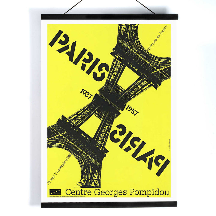 Roman Cieślewicz Paris-Paris 1937-1957 poster with yellow background black Eiffel Tower and mirrored typography, with wooden magnetic frame on white background